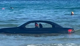 BMW found drifting out to sea after driver parks car on the beach