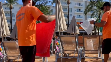 Staff remove belongings from occupied pool loungers at resort