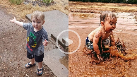 An 18-month-old boy sees rain for the first time in his life, dances with joy and splashes in puddles 
