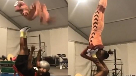 Astounding moment acrobat flips his partner through air with just his feet