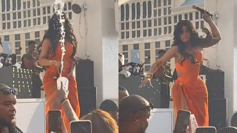 Rapper Cardi B tosses microphone at fans who threw a drink at her in Vegas
