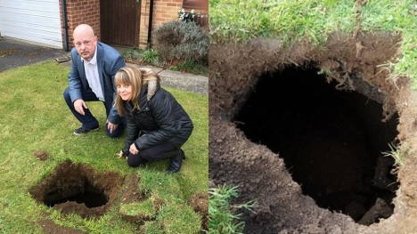 Family baffled after spotting rusty steps lead to mysterious 7ft-deep hole in their lawn 