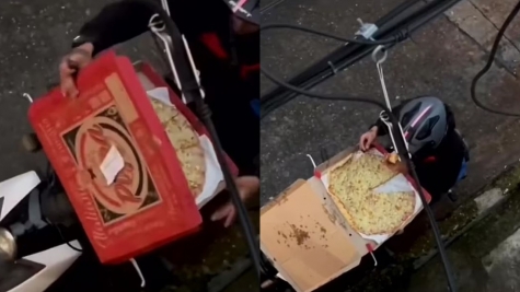 Pizza delivery rider caught tucking into slice before deftly jigsaw-ing the rest back together with a knife