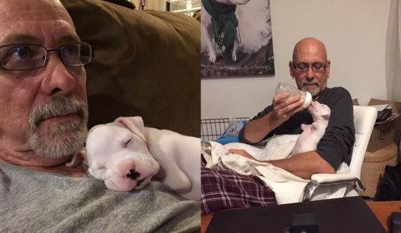 Two-legged dog captivates millions as he is cuddled in his dad's arms