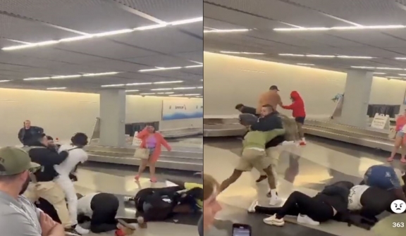 Shocking moment as a fight erupts among travelers at the baggage claim