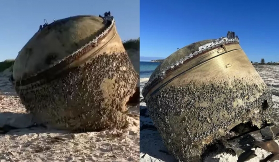 Mysterious cylinder washes up on beach as officials urge public to stay away