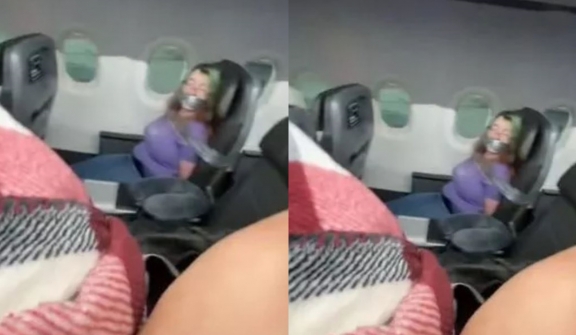 Woman duct-taped aboard American Airlines flight after trying to open the door mid flight