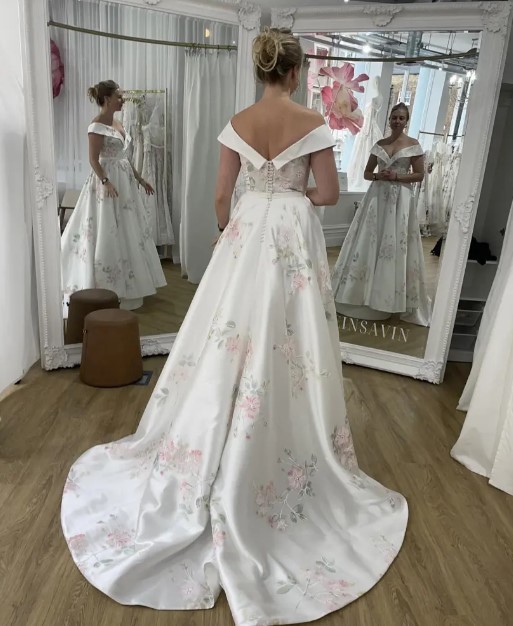 Bride was stunned after iPhone captured two different reflections in the mirror of the wedding store 1