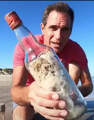 Mysterious 'witch bottles' appear along the beach, raising concern about evil spells 1
