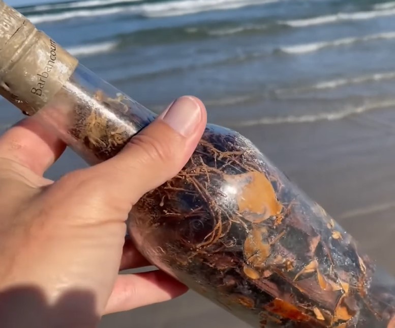 Mysterious 'witch bottles' appear along the beach, raising concern about evil spells 2