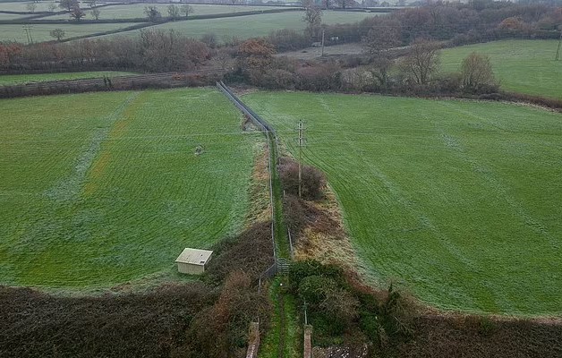 Millionaire farmer builds a 300-ft metal corridor to keep ramblers and dog walkers off his land after a decade 4