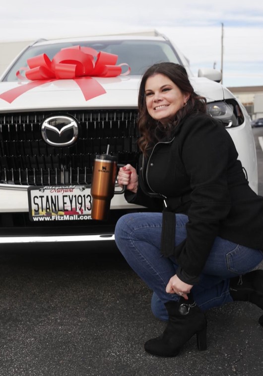 A replacement car from Stanley Cup Company is delivered to the woman whose cup survived a viral car fire. Image Credit: TikTok/@danimarielettering