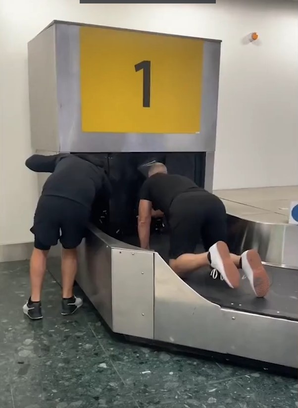 Traveler sparks debate after taking ride on baggage carousel and stating to poop on it for waiting luggage too long 1
