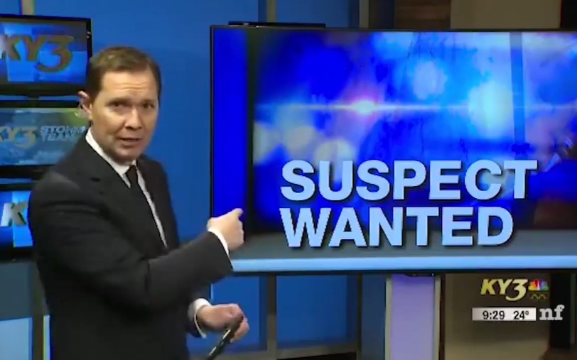 Male news presenter breaks into laughter after seeing police sketch 2