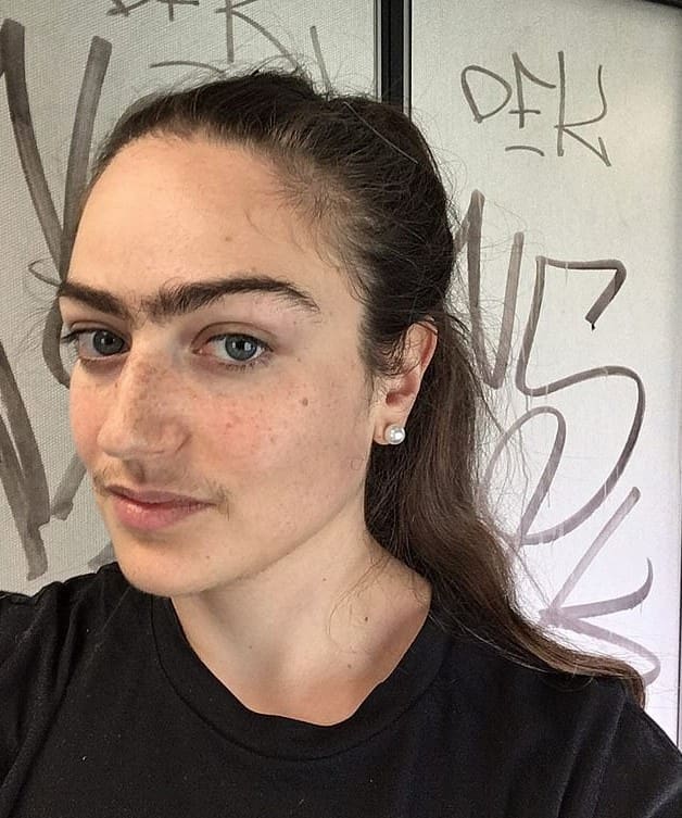 Woman who refuses to shave off her mustache and unibrow claims it enhances her life 3