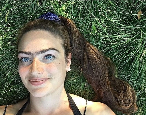 Woman who refuses to shave off her mustache and unibrow claims it enhances her life 2