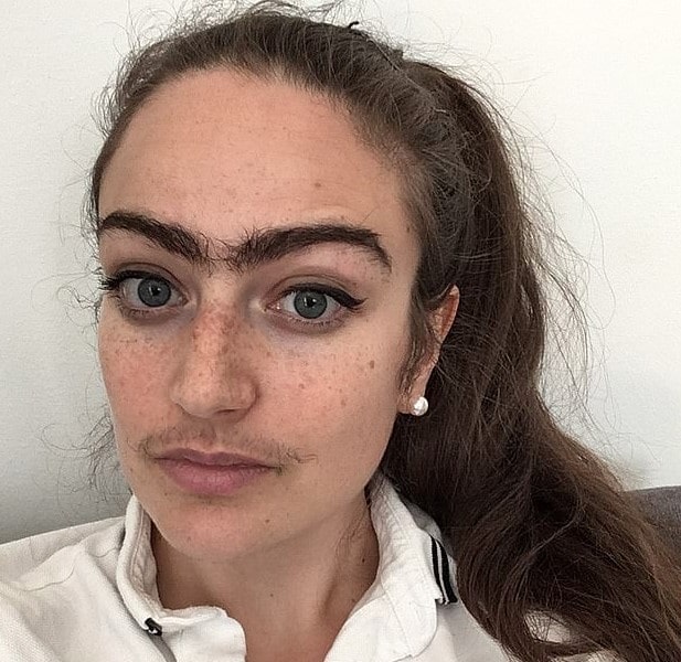 Woman who refuses to shave off her mustache and unibrow claims it enhances her life 4