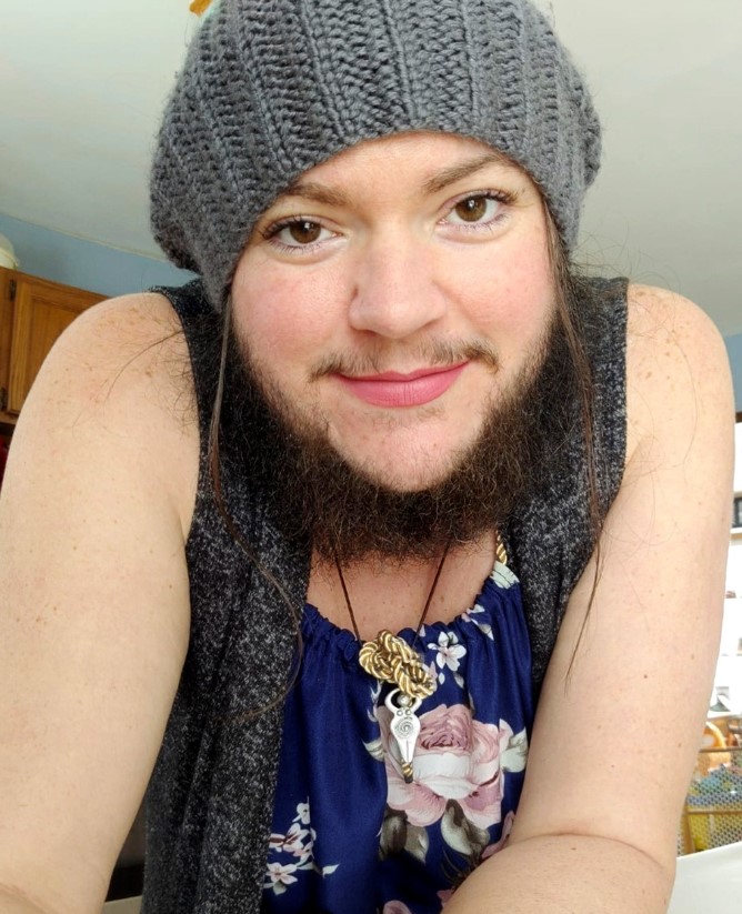 Woman who was bullied due to her naturally bushy beard decided to grow out her whiskers 2