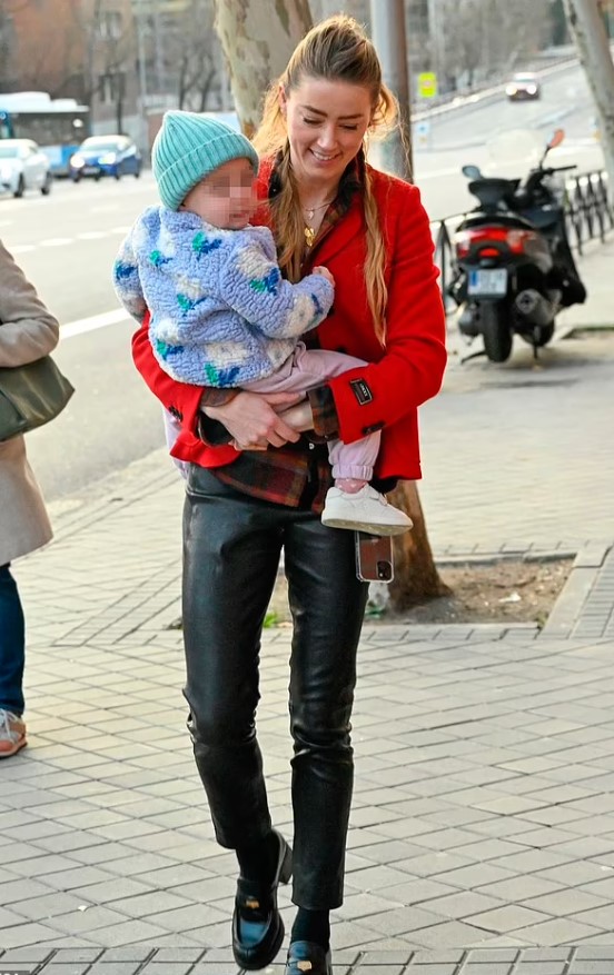 Amber Heard walks on the streets of Spain with her 2-year-old daughter. Image Credit: MEGA