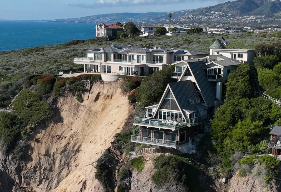 The image of one house appears to be suspended over the cliff. Image Credit: ABC 7