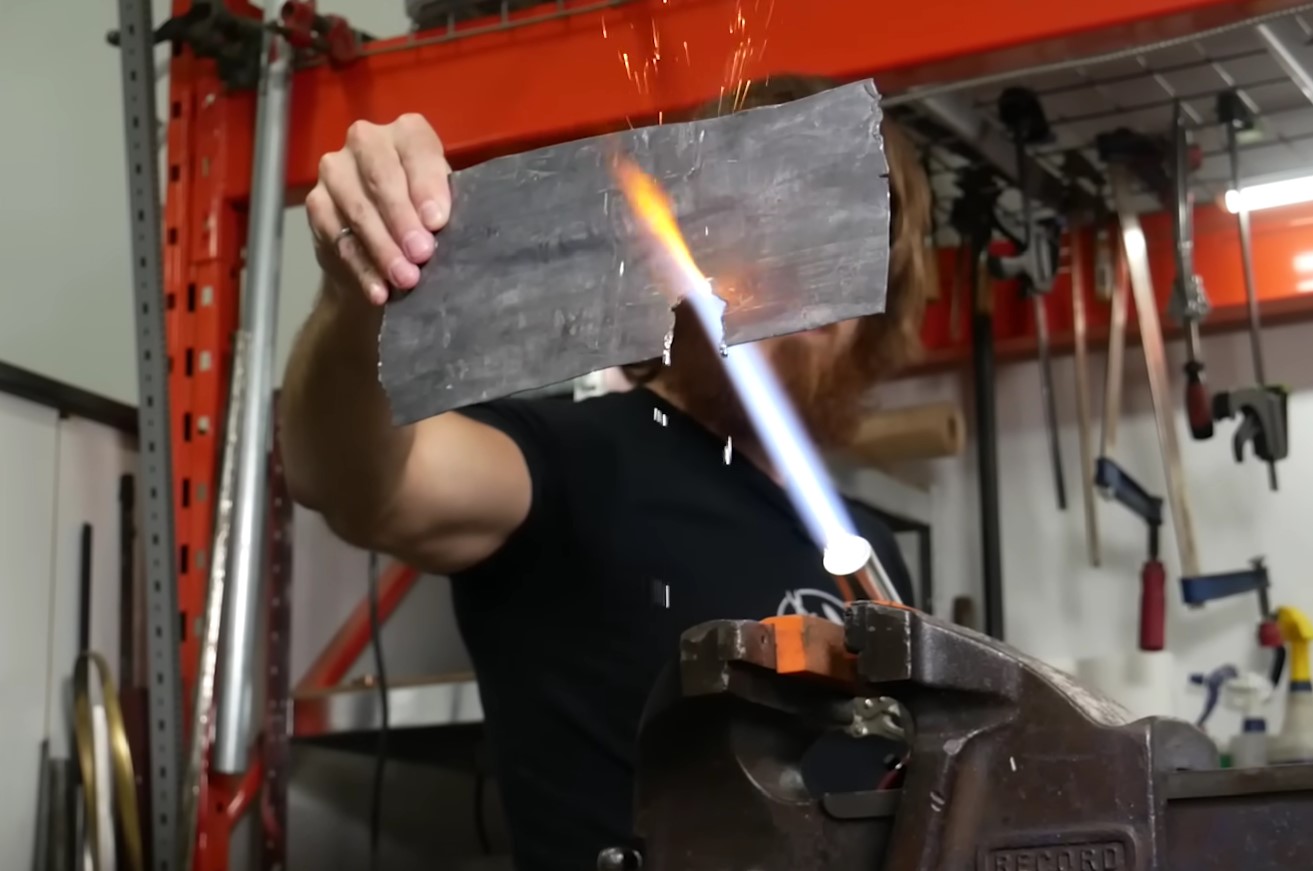 The lightsaber burns at an incredible 4,000 degrees Fahrenheit and can easily cut through metal. Image credit: Hacksmith Industries