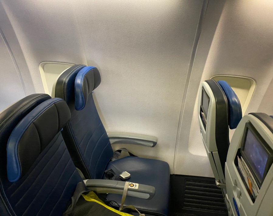American airline passenger gets furious after being put in window seat that has no window 1