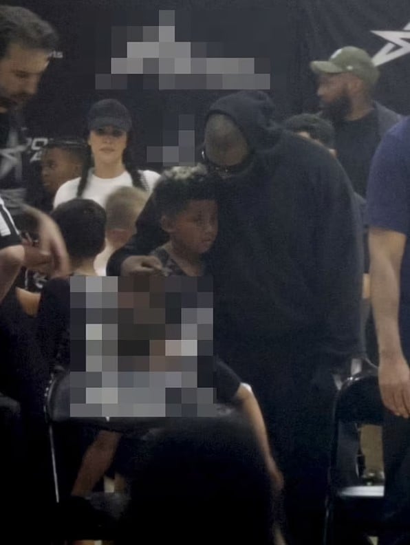 Kanye West and his ex-wife Kim Kardashian were seen hugging each other at their son's basketball game in LA 3