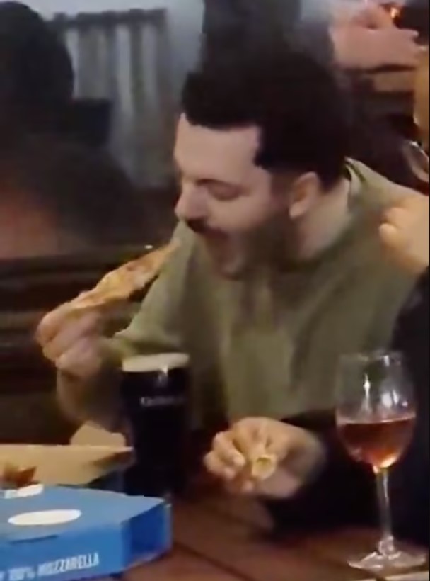 Man was captured dipping Domino's Pizza slice into a pint of Guinness to eat 4