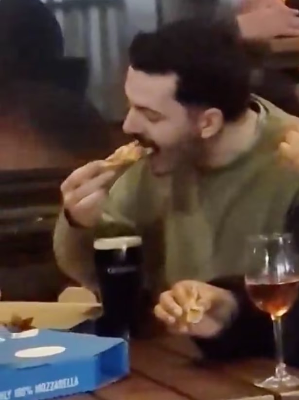 Man was captured dipping Domino's Pizza slice into a pint of Guinness to eat 3