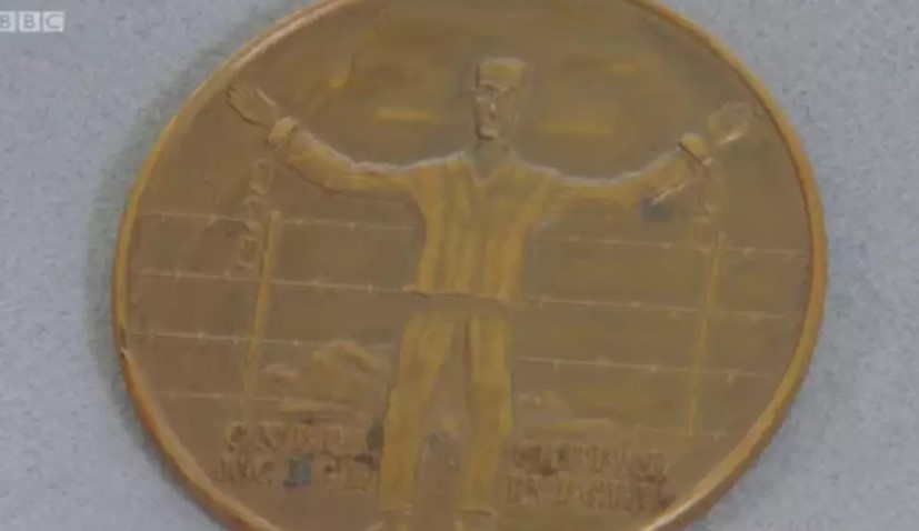 Smith found that the medallion was a 10th-anniversary medal for liberated concentration camp survivors. Image Credit: BBC