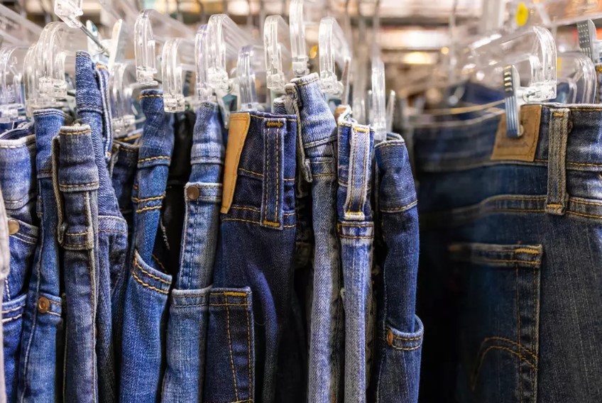 Wearing fast-fashion jeans has an environmental impact comparable to driving a car. Image Credit: Getty