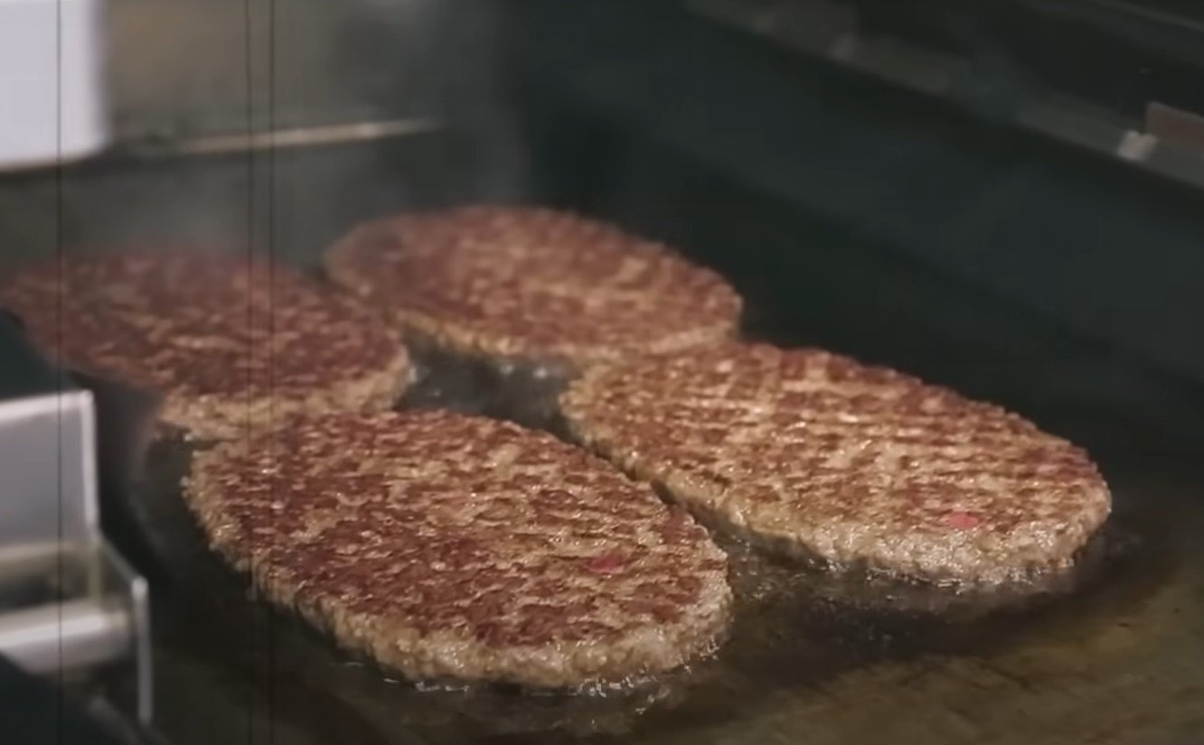 Cooked patties are stored in a warming cabinet until served, maintaining temperature and texture. Image Credit: Youtube