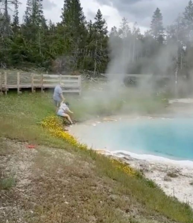 The woman quickly realized the extreme temperature of the hot spring after dipping her hand into it. Image Credit: Gary Mackenzie / Instagram