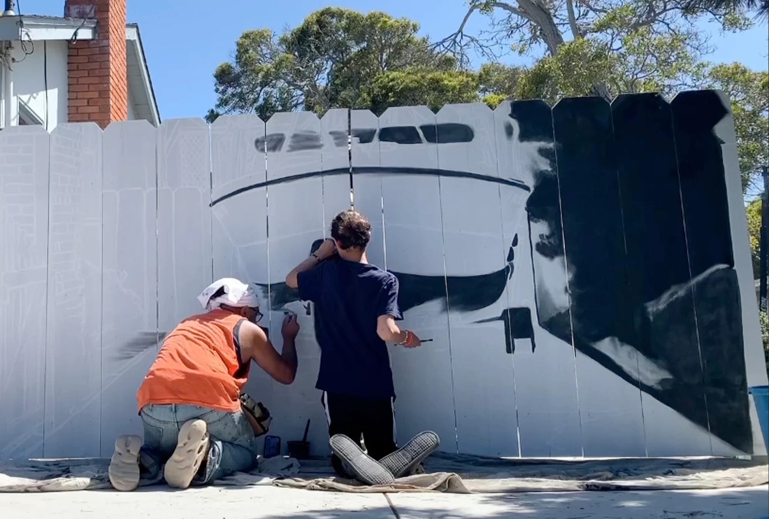 They painted a boat mural on the new fence together, cleverly hiding the actual boat. Image Credit: Reddit