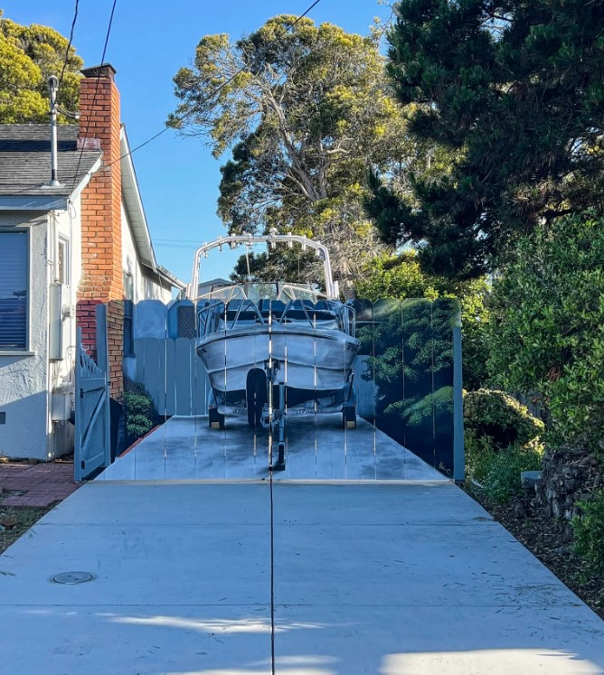 The homeowner's driveway boat drew negative attention as neighbors found it unsightly. Image Credit: Reddit