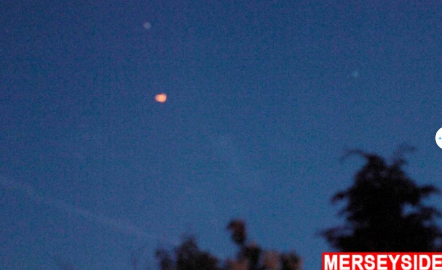 Onlookers baffled after witnessing numerous bizarre orange UFOs floating in the sky 5