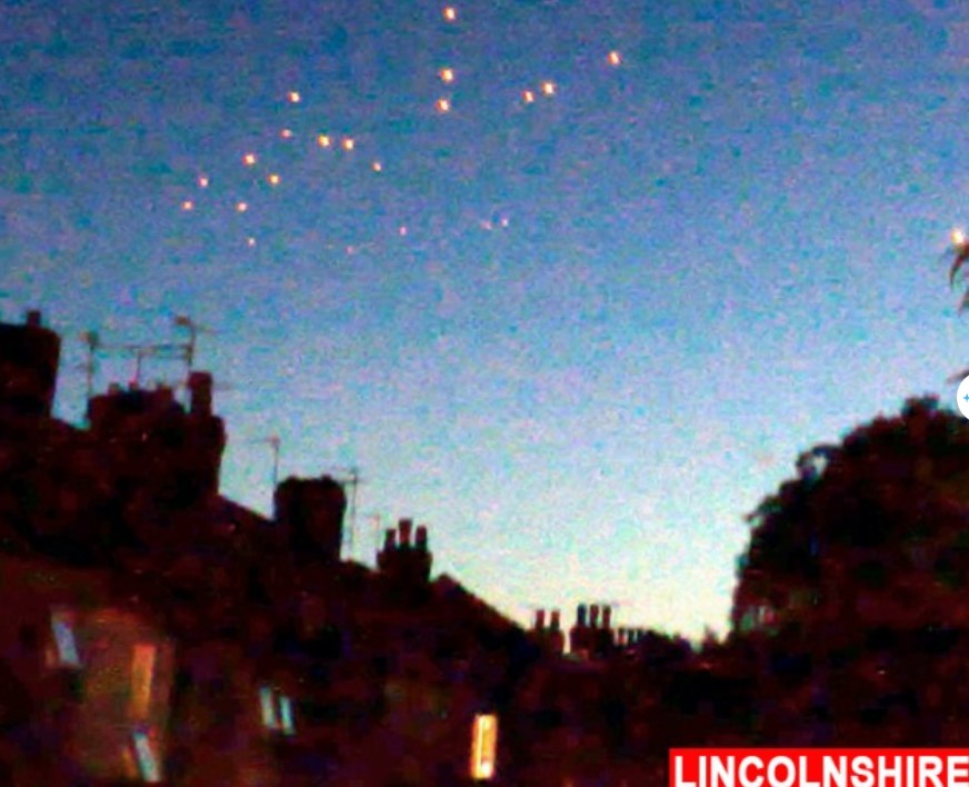 Onlookers baffled after witnessing numerous bizarre orange UFOs floating in the sky 3