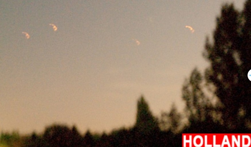 Onlookers baffled after witnessing numerous bizarre orange UFOs floating in the sky 4