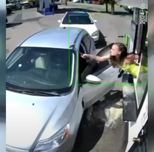 Emma retaliated by smashing the customer's windshield with a hammer. Image Credit: YouTube.