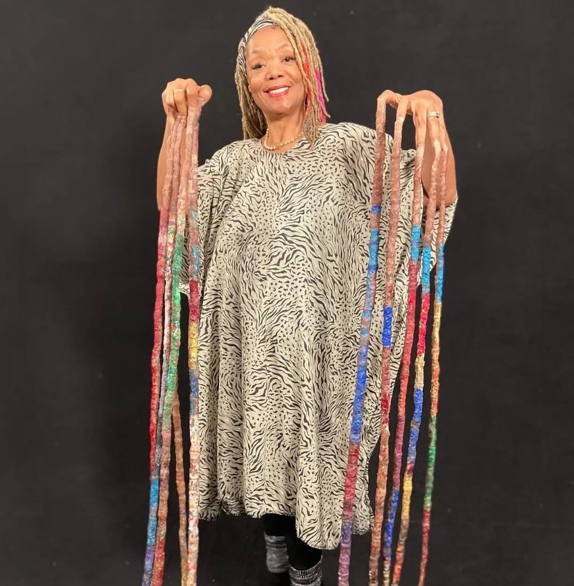 Diana Armstrong holds the record for the world's longest nails, measuring over 42 feet in total length. Image Credit: Guinness World Record