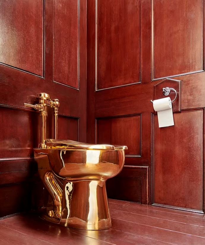 Four people were charged with stealing a $6 million, 18-carat solid gold toilet. Image Credit: PA