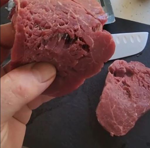 The TikToker shared a video pulling apart two supermarket steaks to show 