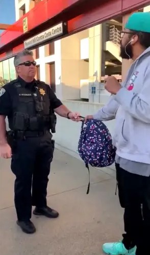 A video by Nicole Hernandez shows BART representatives detaining Foster. Image Credit: ABC7 News Bay Area