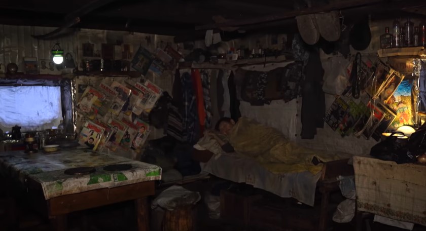 His walls display colorful magazines and clippings. Image Credit: YouTube/Kiun B