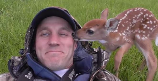 Touching the attached baby deer refuses to go away from the man who saved her life! 4