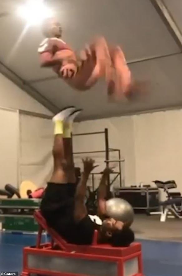 Astounding moment acrobat flips his partner through air with just his feet 3