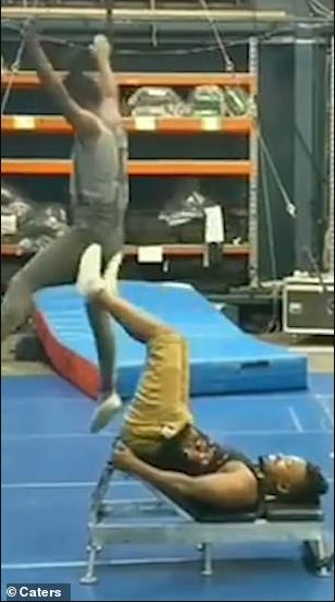 Astounding moment acrobat flips his partner through air with just his feet 5