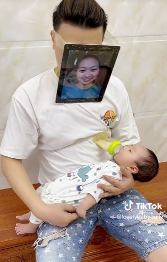 Dad goes viral on TikTok for wearing mother's mask to teach breastfeeding to his son 2