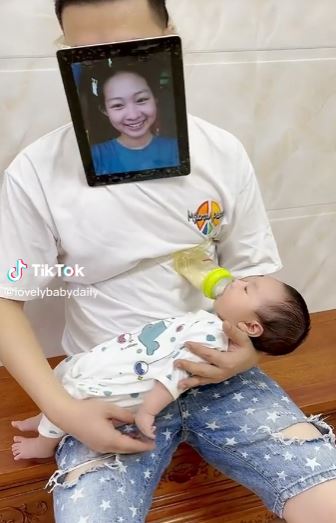 Dad goes viral on TikTok for wearing mother's mask to teach breastfeeding to his son 3