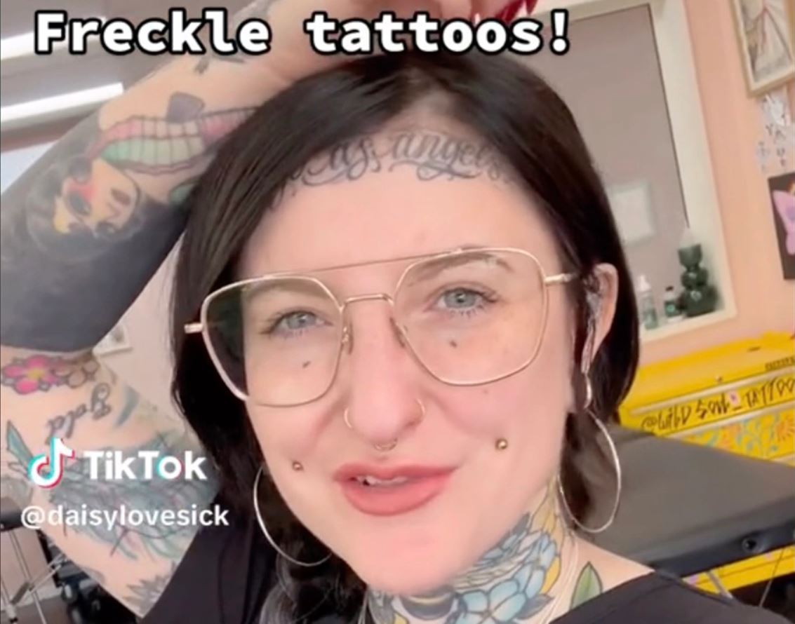 A woman gets fake freckles tattooed, with some predicting that they will 'age like a tramp stamp' 1